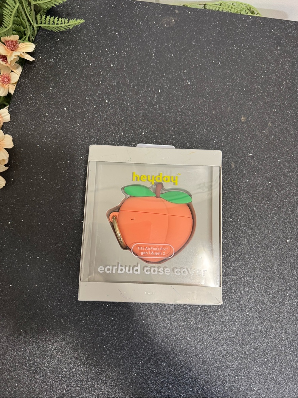 & Other Stories Orange Peach Earbud Case with Green Leaf